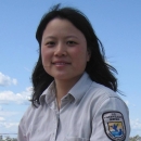 Image of woman with blue sky behind her