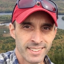 Headshot of smiling man.