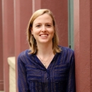 Amanda smilesin a blue stripped blouse 