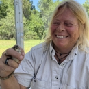 Cheryl Samek holding a Florida Grasshopper Sparrow.