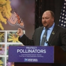 Chuck Traxler speaks at a protect pollinators event with the U.S. Postal Service