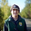 man in hat by a road