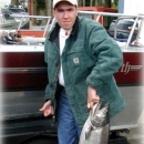 Todd Gilmore holding a salmonid