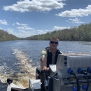 Jorge Buening driving a boat.