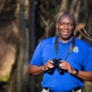 Jerome Ford holding binoculars