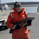 Fish Biologist holding a snakehead