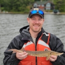 Man holds sturgeon