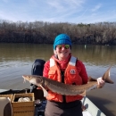 Sara Seagraves Holding a Lake Sturgeon