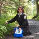 a woman on a wooded trail