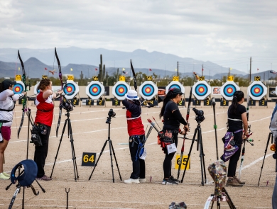 Five archers line up to shoot targets at the Arizona Cup. 