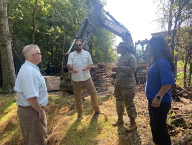 U.S. Fish and wildlife staff talk with Fort Meade's Colonel Gore about stream restorationists Ben Hutzell speak with Colonel Gore and ARD Sharon Marino about stream restoration techniques