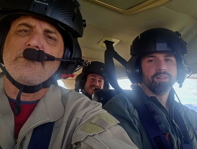 Aerial survey crew Zach Lyall (front right), Jeff Drahota (front left), and Trey McClinton in a plane