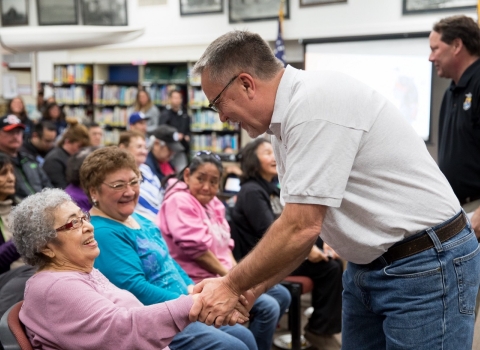 Greg Siekaniec gives a warm handshake to 90 year old internment survivor Haretina Krukoff following the USFWS’s apology 