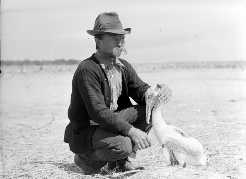 man (Paul Kroegel) kneeling