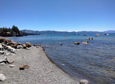 Boats and water recreators are pictured on a large lake