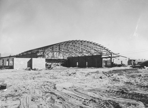 Ground level view of hangar under construction. 