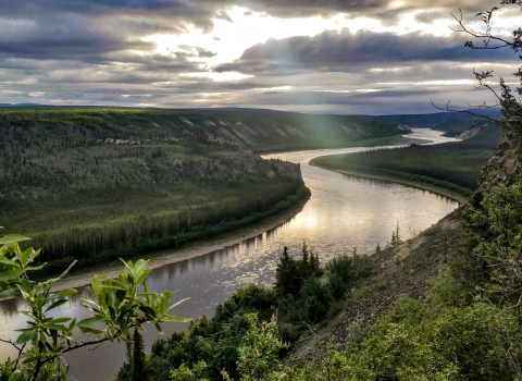 Landscape view over a river and boreal forest