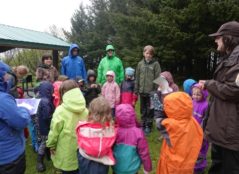 a group of kids in the rain