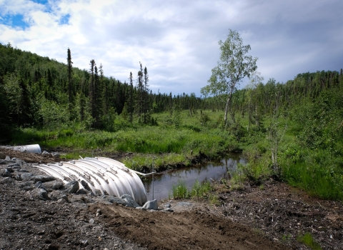 A new culvert extends beneath a road in Wasila, AK, to improve fish passage for salmon.