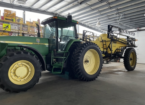 large tractor with an attachment on the back