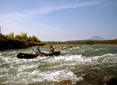 Paddlers navigate rapids on Alaska’s Sheenjek River