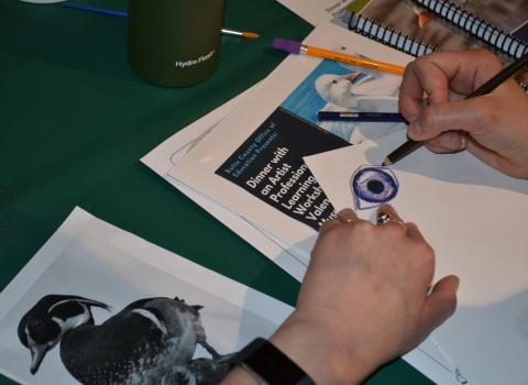 Someone draws a duck eye for the Junior Duck Stamp Program. 