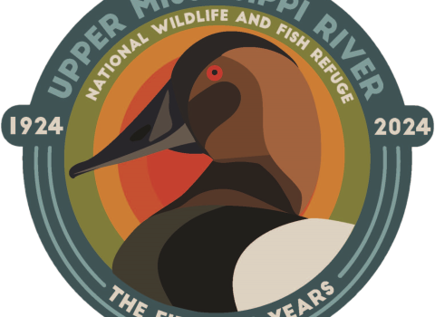 Logo with canvasback duck and text saying Upper Mississippi River national Wildlife and Fish Refuge The First 100 years