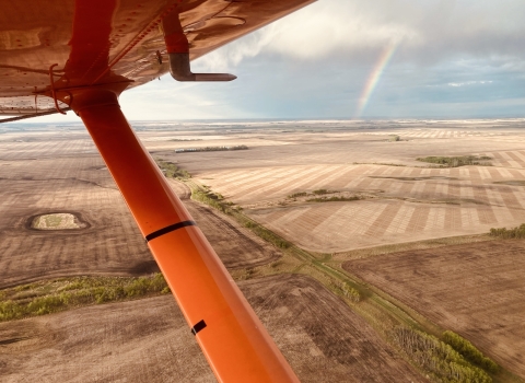aerial view of a rainbow over the landscape