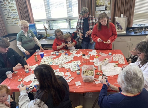 People crafting around a table