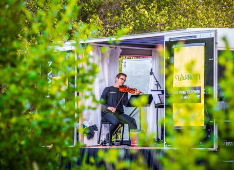 A pianist performs with a string quartet at a national wildlife refuge